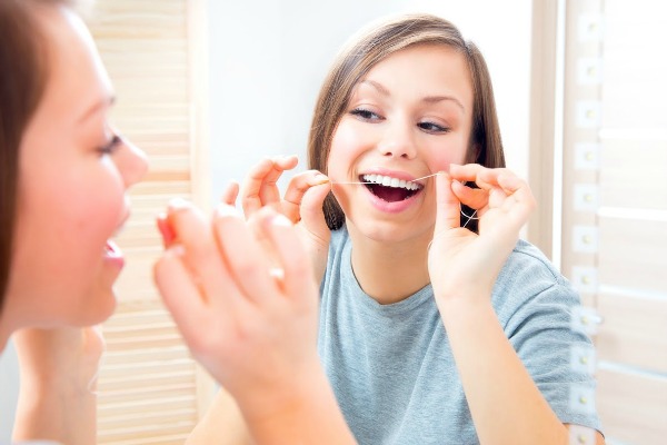 how to floss the right way bakersfield dentist